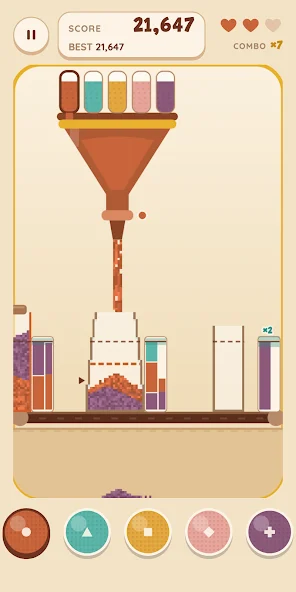 Siftline’s coloured sand flowing through a funnel into cups on a conveyor.